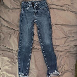 American Eagle Outfitters Blue Skinny Jeans with Distressed Hem